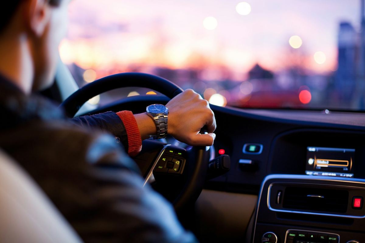 Driver’s hands on the wheel on an open Australian road